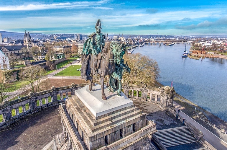 tall horse and rider statue overlooking river in koblenz germany